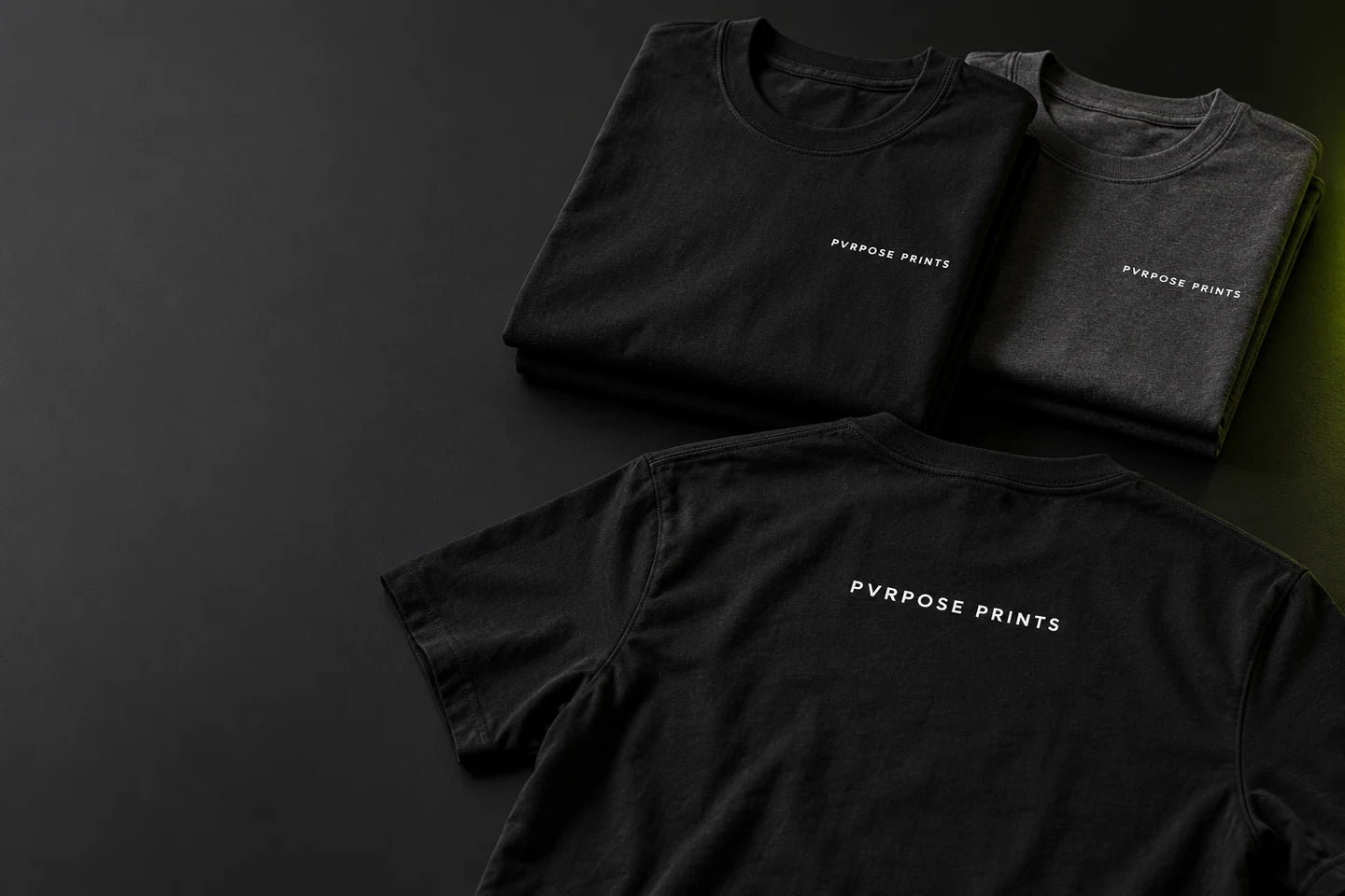 Illustrative PVRPOSE Prints black crew shirt concept with white artwork and a lime accent
